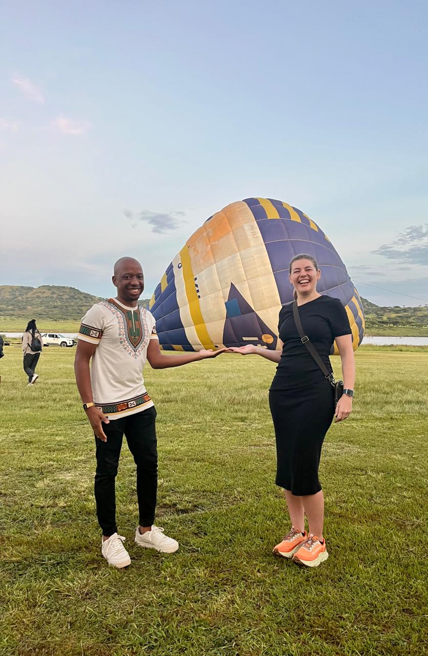 Njabulo and Uma together beside a hot-air balloon