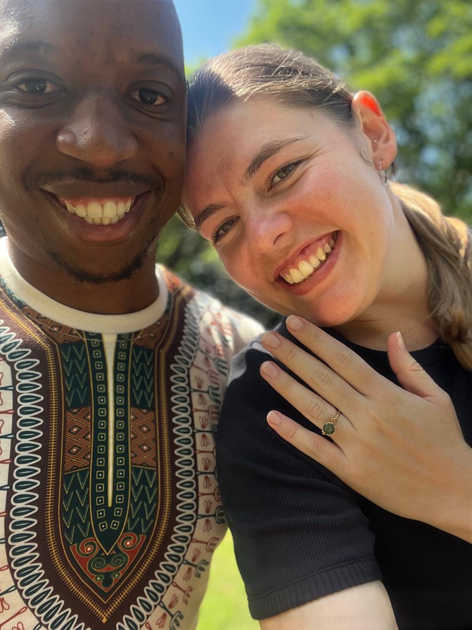 Njabulo and Uma smiling as Uma shows her engagement ring