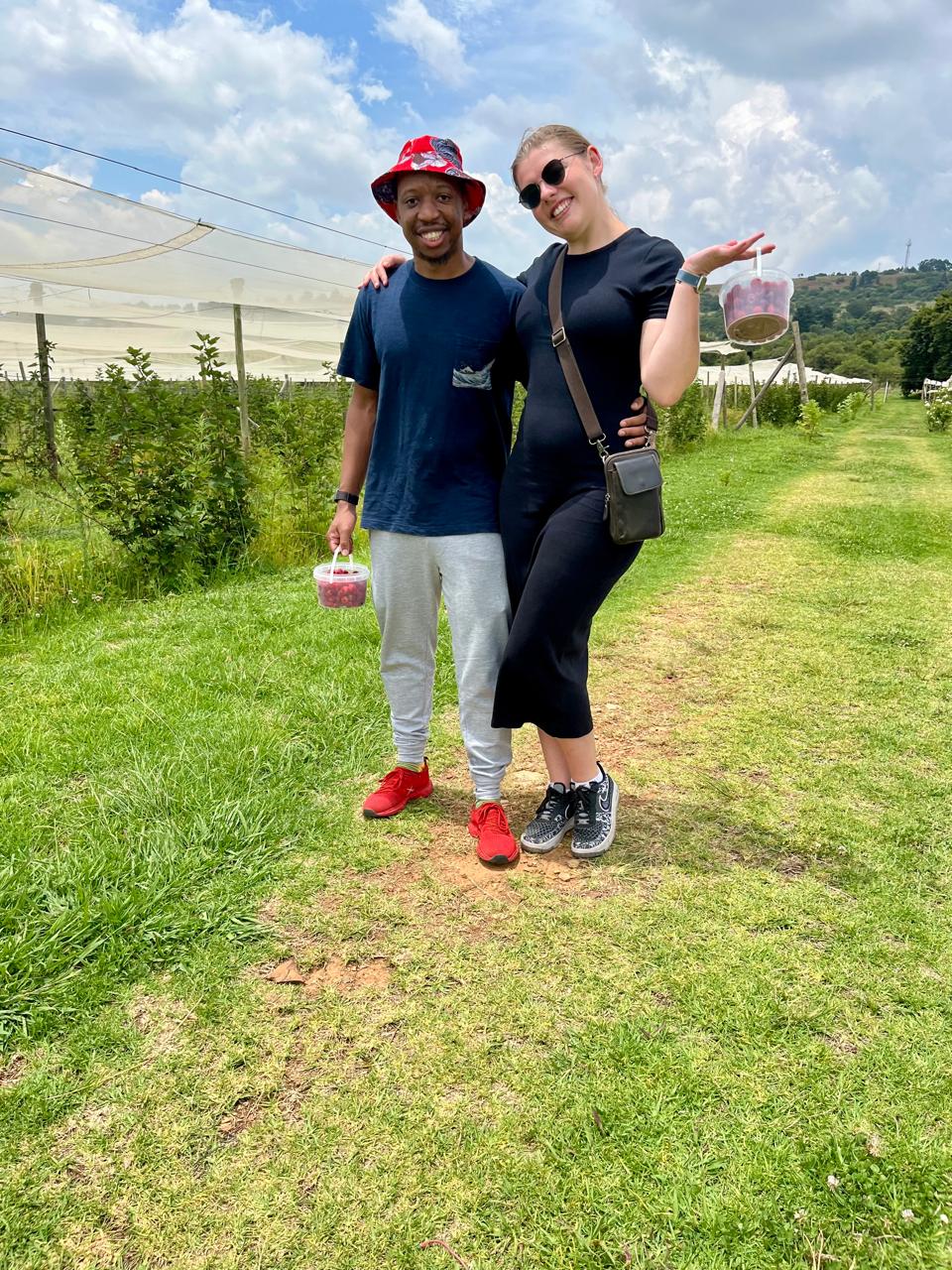 Njabulo and Uma together while berry picking